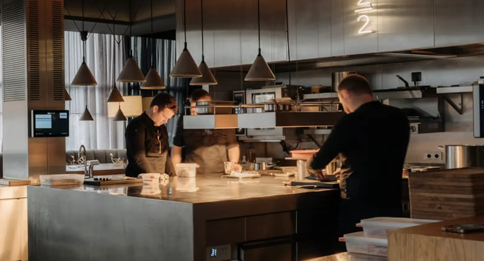 Chefs working in the open kitchen at Restaurant 212